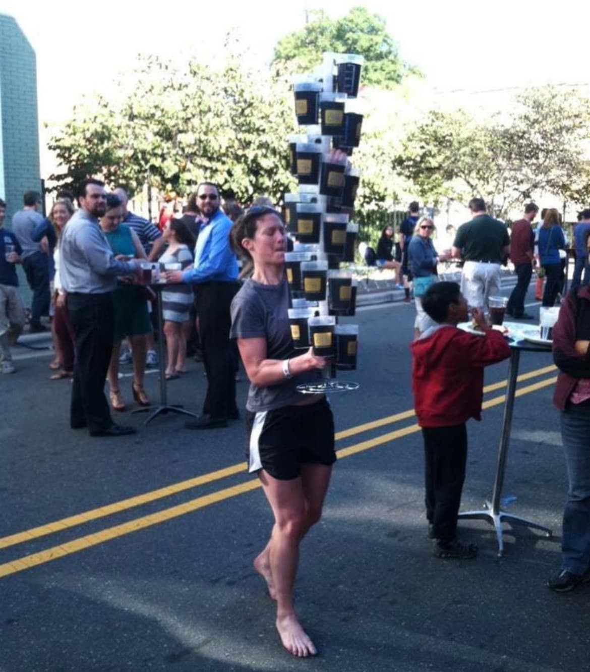 Event manager calculating carbon emissions for festival drinkware