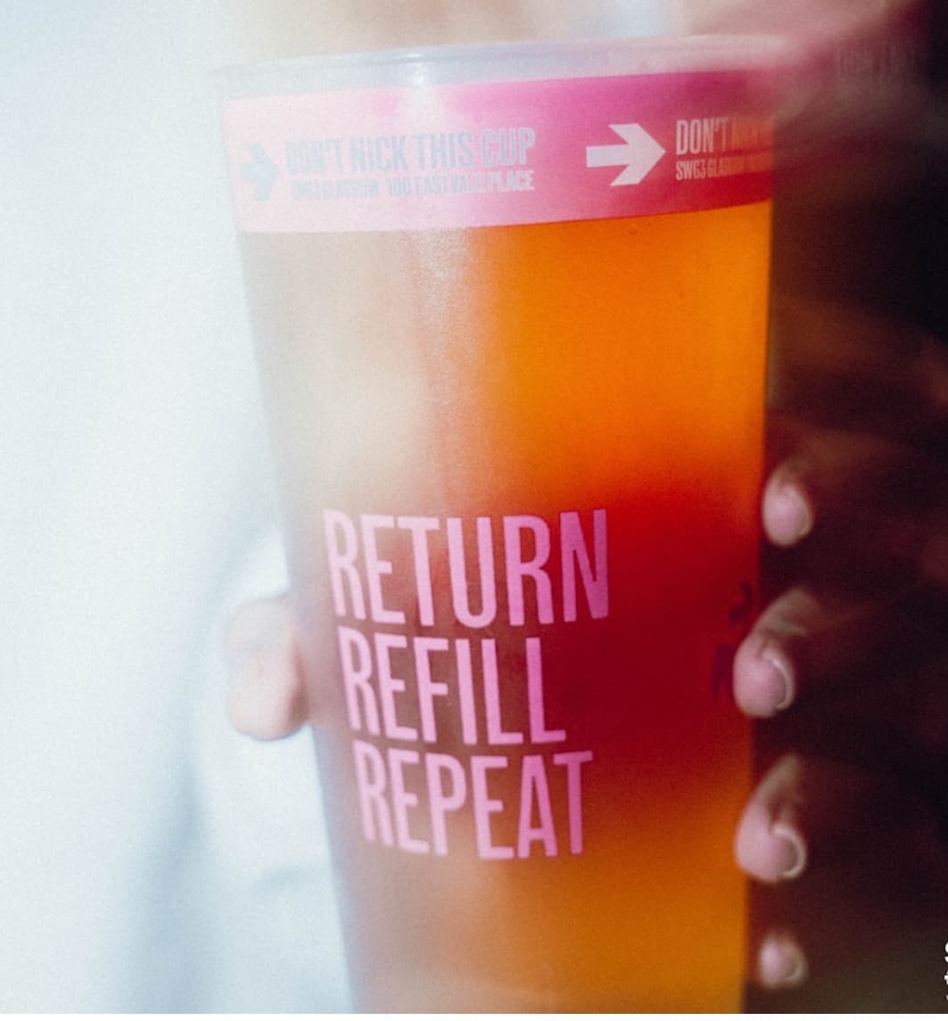 Bartender pouring beer into a legal measure pint cup
