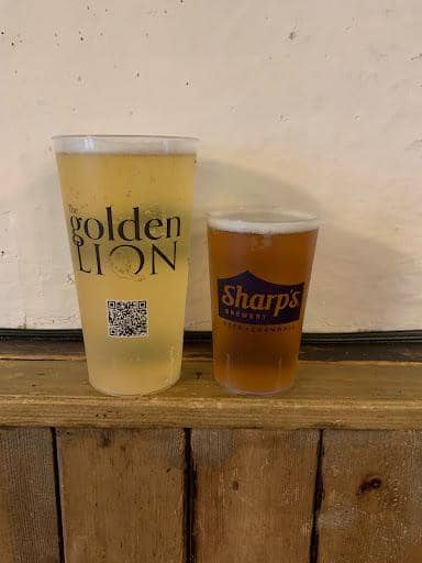 UKCA marked arena pint cups being poured